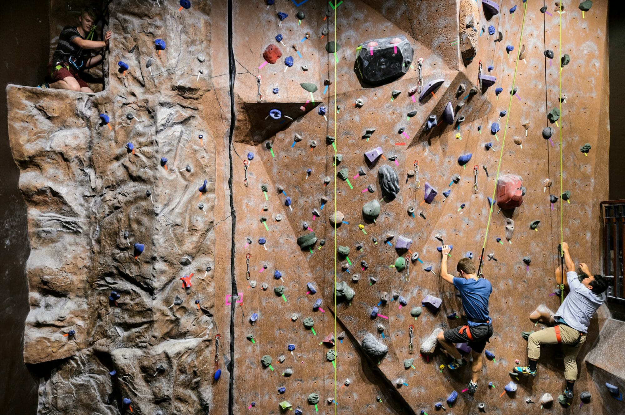 Students climb on climbing wall at Union South