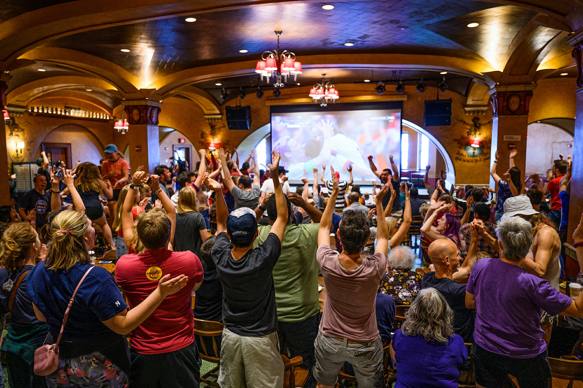 Spectators in the Memorial Union Rathskeller watch the 2019 Women's Soccer World Cup final game and cheer