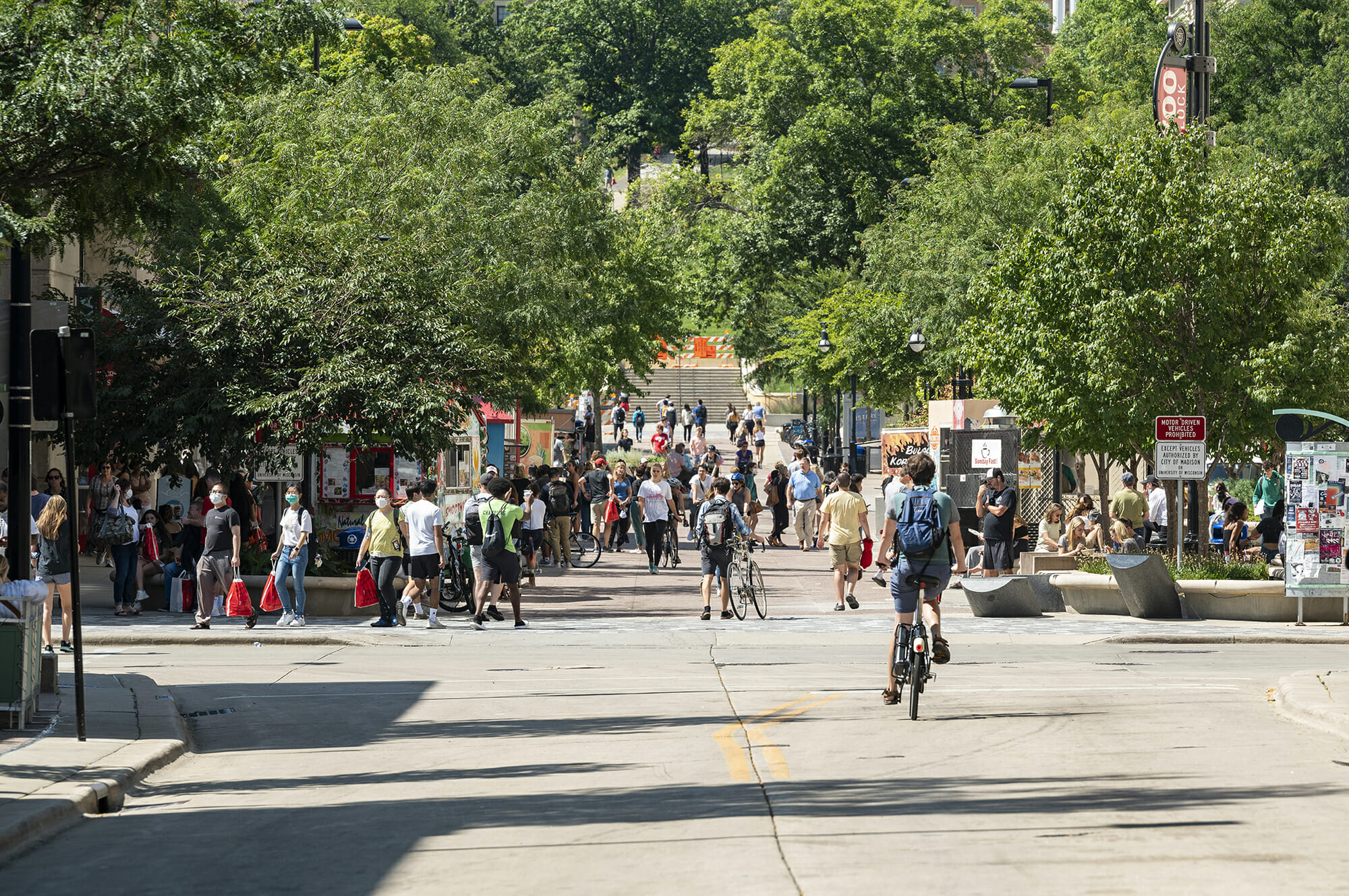 Library Mall, busy with food carts, bikers, and students walking to and from classes.